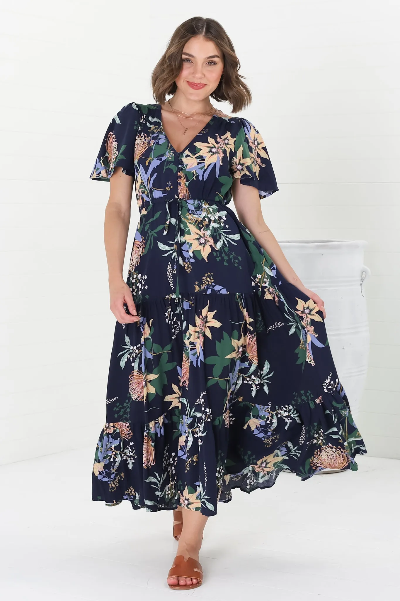 Adhira Maxi Dress - Buttoned Bodice A-Line Dress with Flute Sleeves in Raven Print Navy sold by Salty Crush