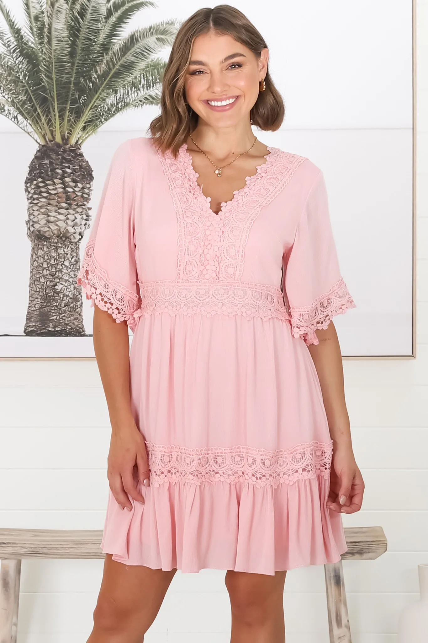 Leelie Mini Dress - Lace Embellished Tiered Dress with Bell Sleeves in Pink sold by Salty Crush