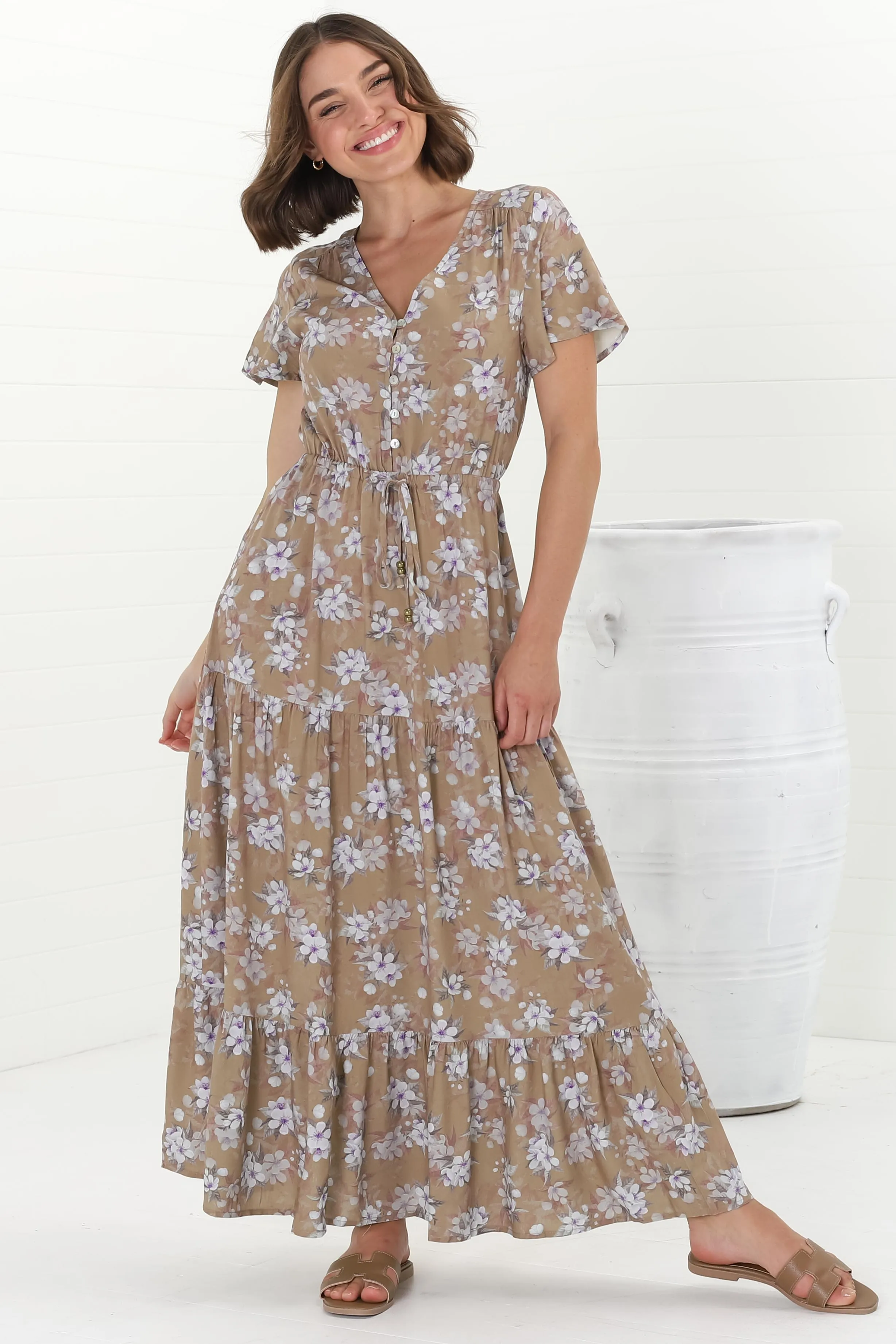 Hanna Maxi Dress - Cap Sleeve Tiered A Line Dress with Toggle Detailed Waist Tie in Ishaka Print Beige sold by Salty Crush