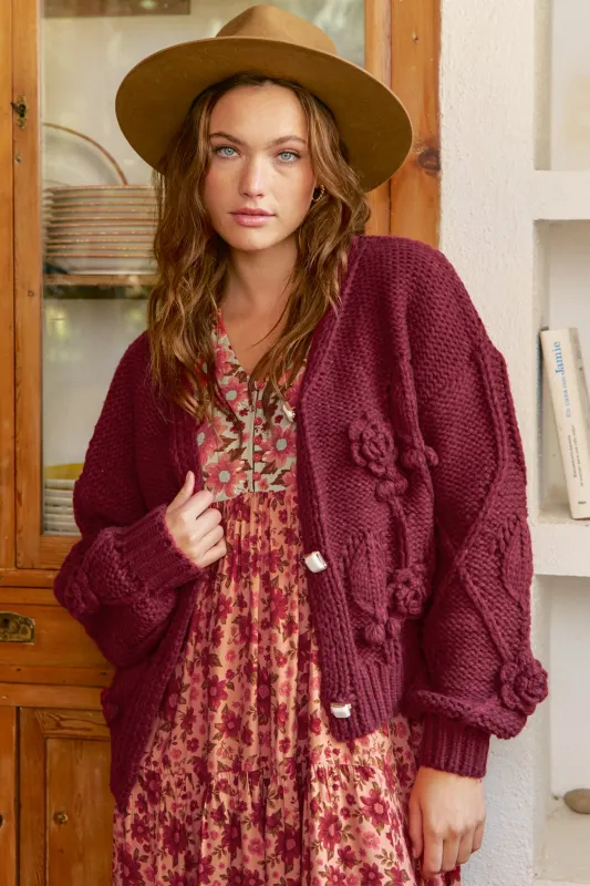 JAASE - Cozy Knit: Floral Motif Chunky Knit Cardigan with Vintage Inspired Buttons in Maroon made by Jaase