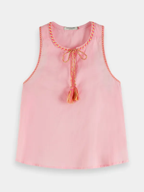Sleeveless tank with gathering and ties sold by Scotch and Soda