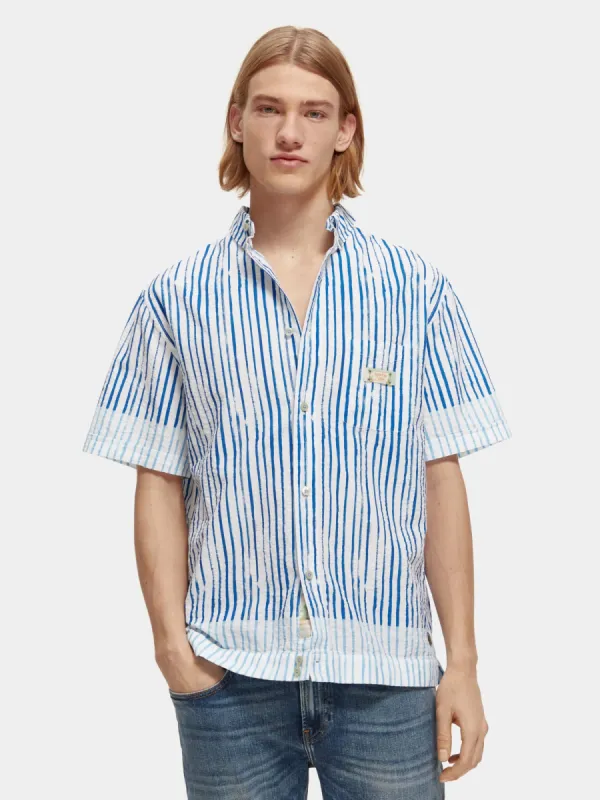 Short sleeve printed seersucker stripe sold by Scotch and Soda
