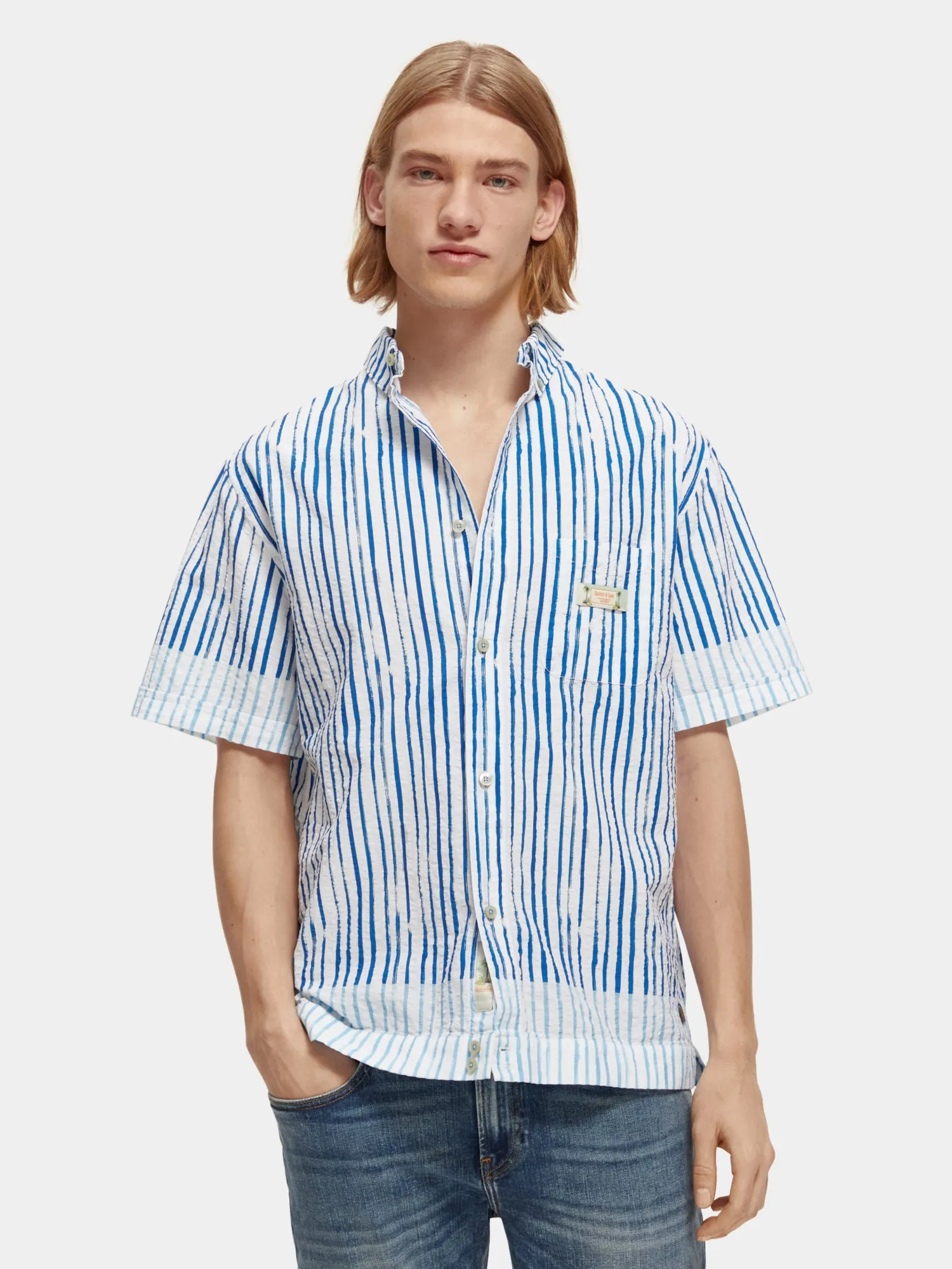 Short sleeve printed seersucker stripe sold by Scotch and Soda