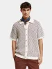 Button-down knitted polo sold by Scotch and Soda