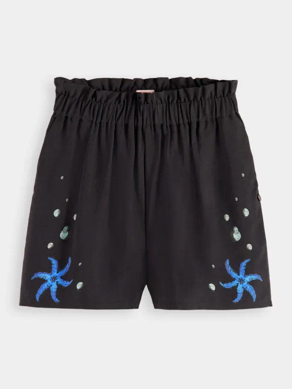 Placement print shorts sold by Scotch and Soda