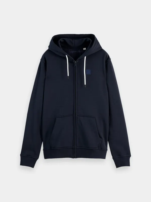 Logo badge zip-through hoodie sold by Scotch and Soda