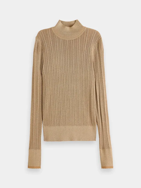 Metallic pointelle pullover sold by Scotch and Soda