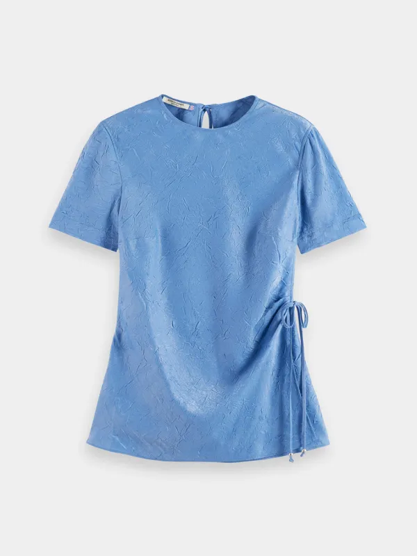 Crushed satin wrap top sold by Scotch and Soda