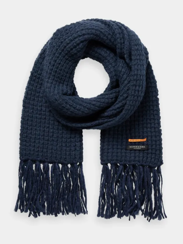 Waffle stitch fringed scarf sold by Scotch and Soda