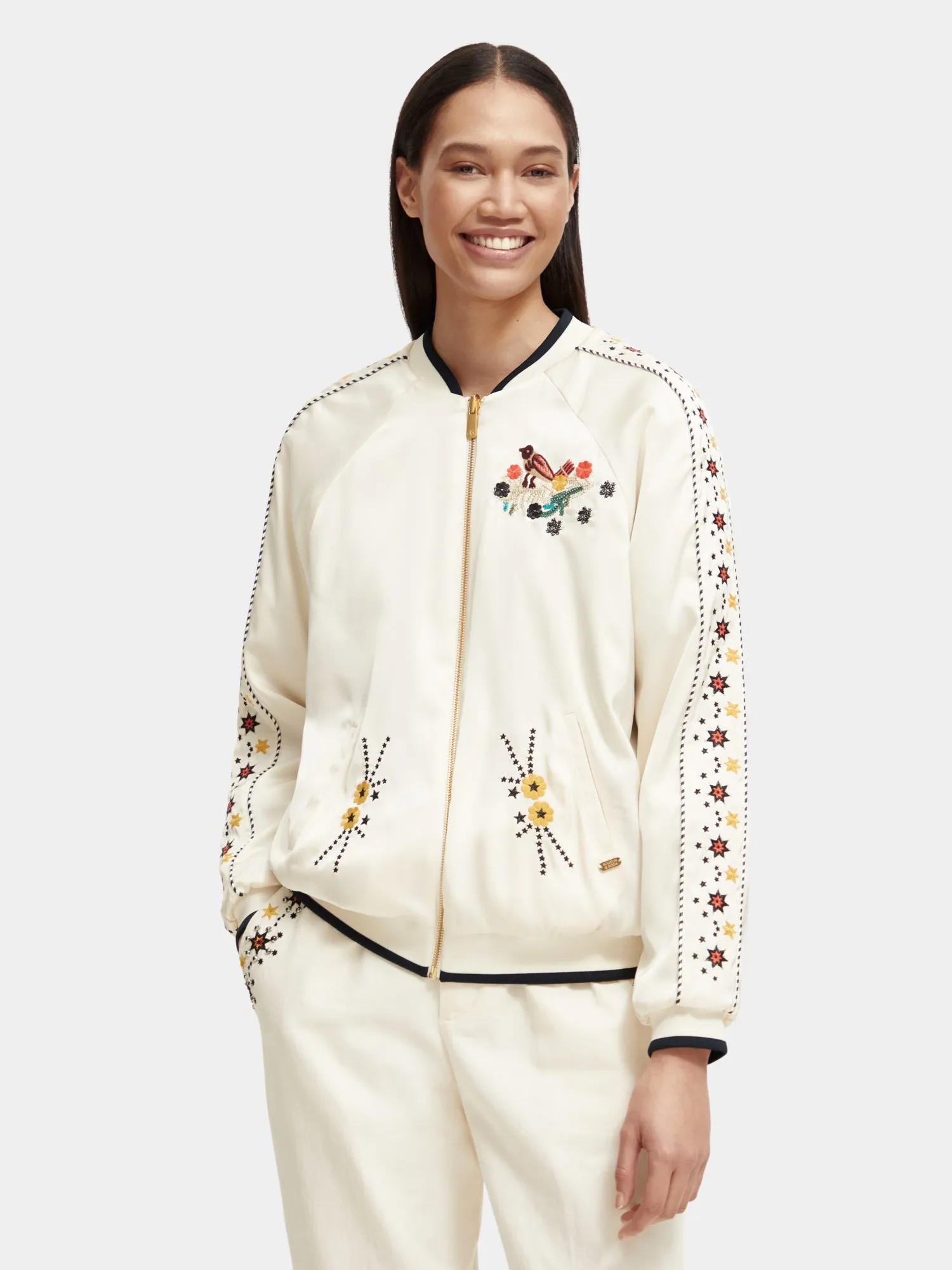 Reversible embroidered bomber jacket sold by Scotch and Soda