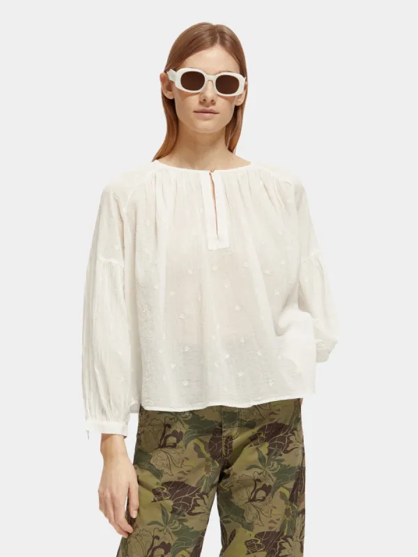 Voluminous popover top with allover embroidery sold by Scotch and Soda