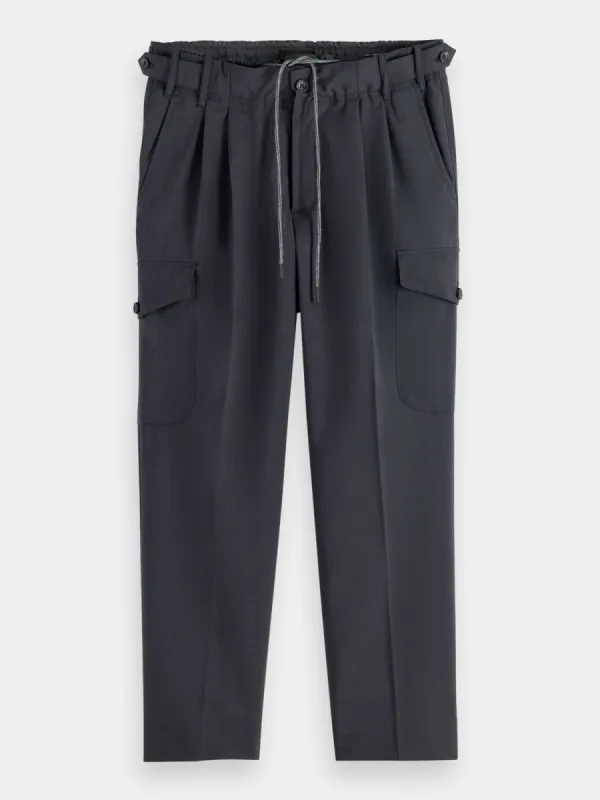 Loose tapered wool cargo pants sold by Scotch and Soda