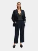 Loose tapered pinstripe pants sold by Scotch and Soda