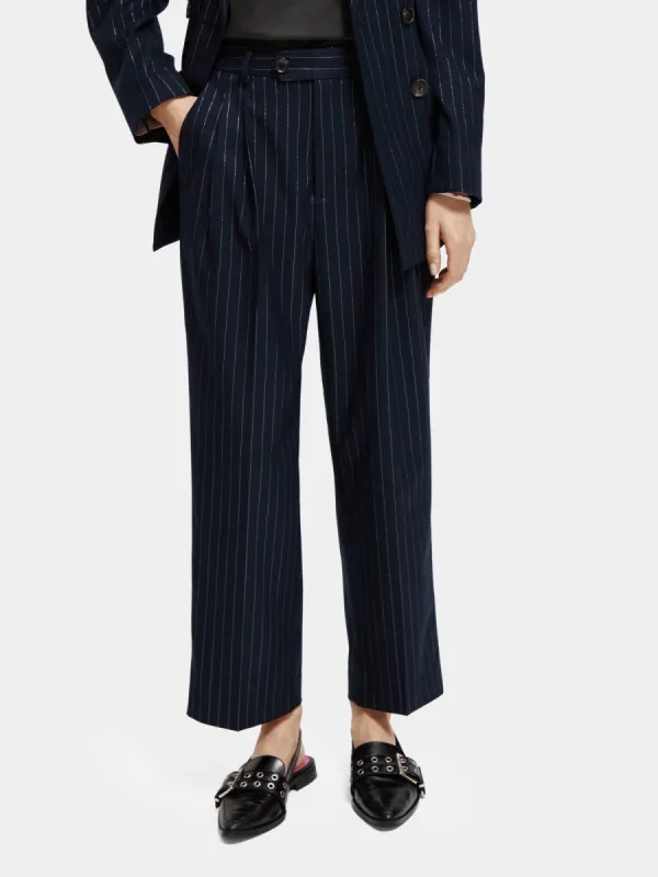 Loose tapered pinstripe pants sold by Scotch and Soda