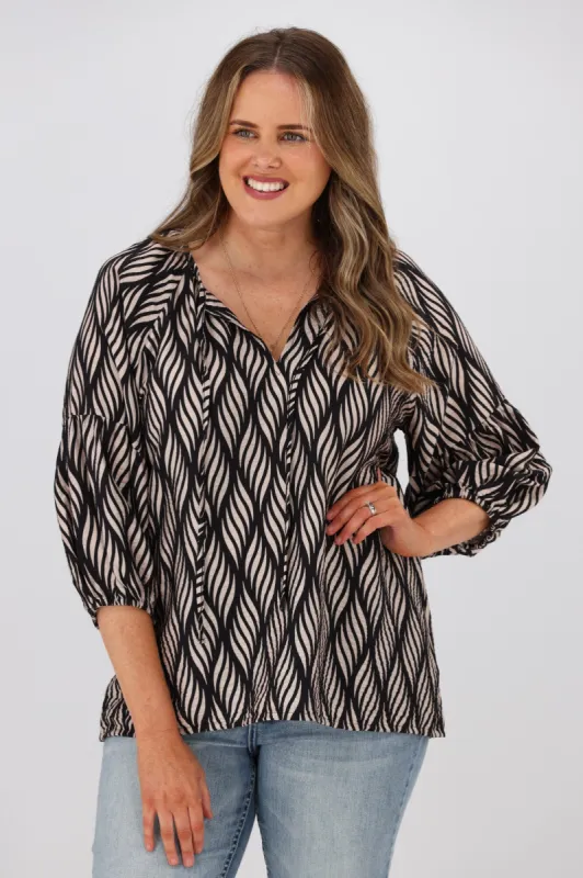 Gloss by Shine On Dana Tie Blouse Spiraling Geo Print sold by Shine On