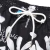 Men's beach pants loose casual cartoon printed shorts sold by Shopnova