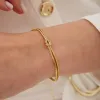 Snake Chain Knot Bracelet & Choker Set in Sterling Silver sold by Spero London