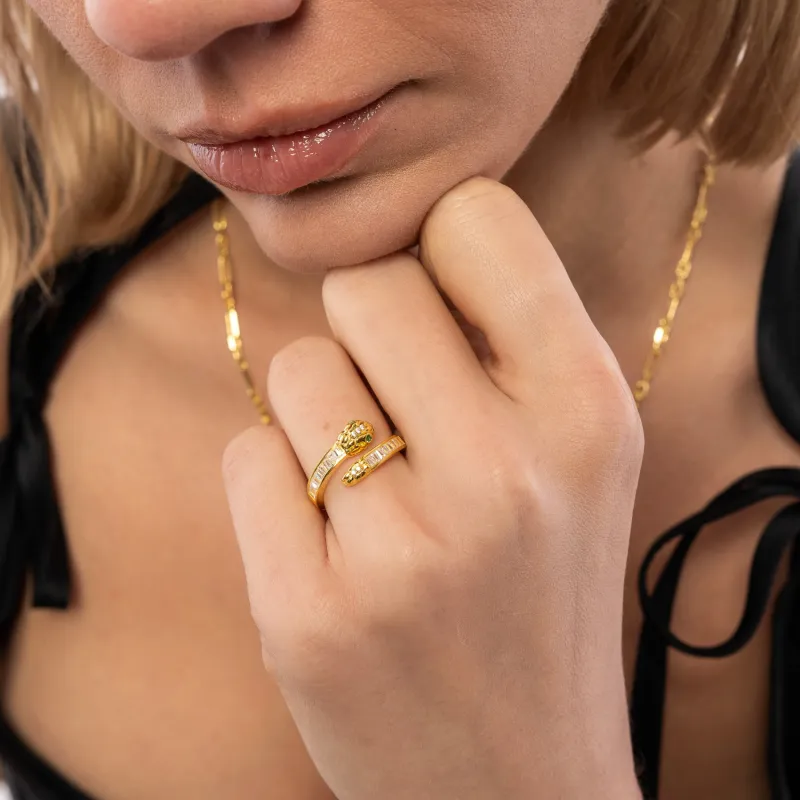 Baguette Snake Ring With Green Eyes in Sterling Silver sold by Spero London