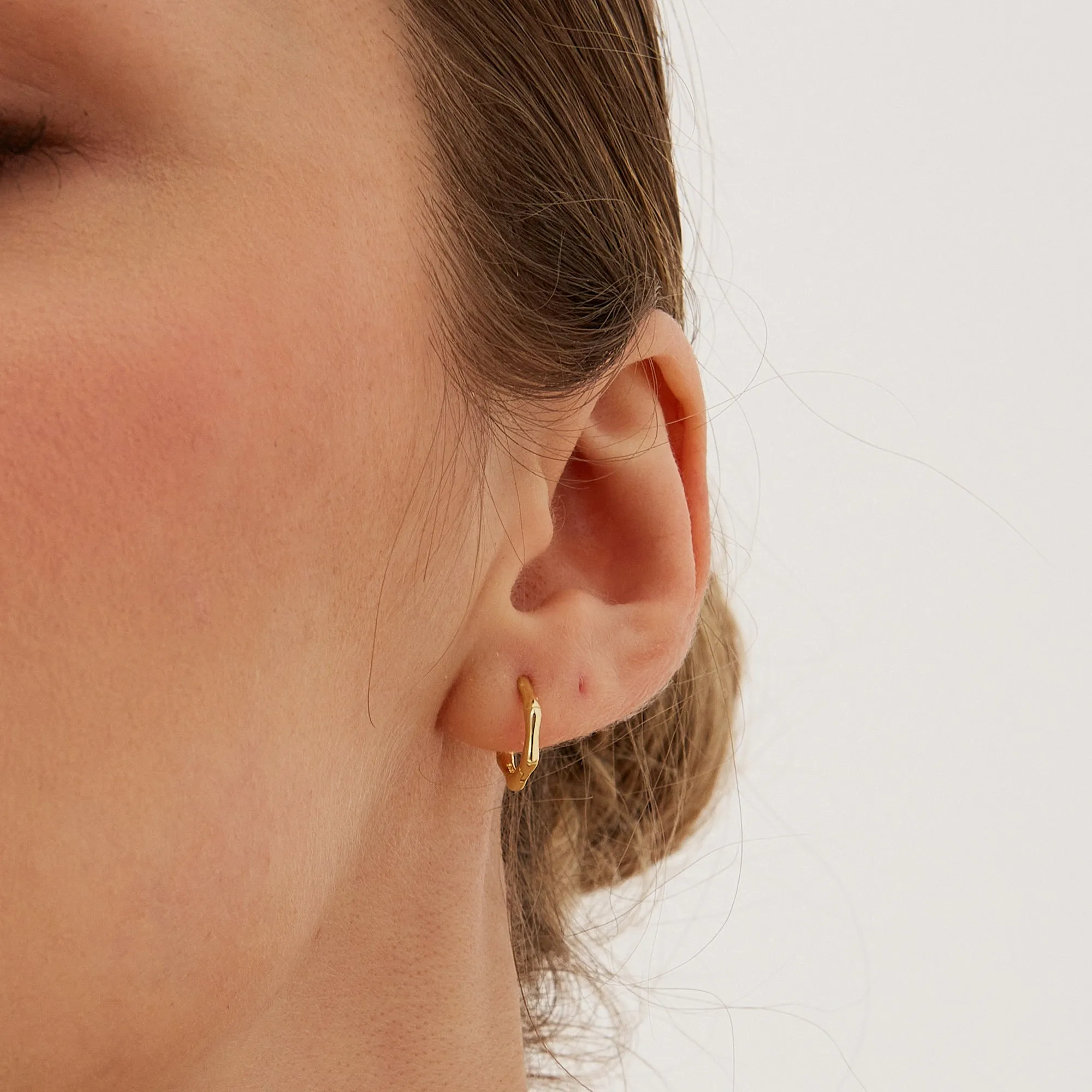 Bone Shape Hexagonal Huggie Hoop Earrings in Sterling Silver sold by Spero London product image thumbnail 3