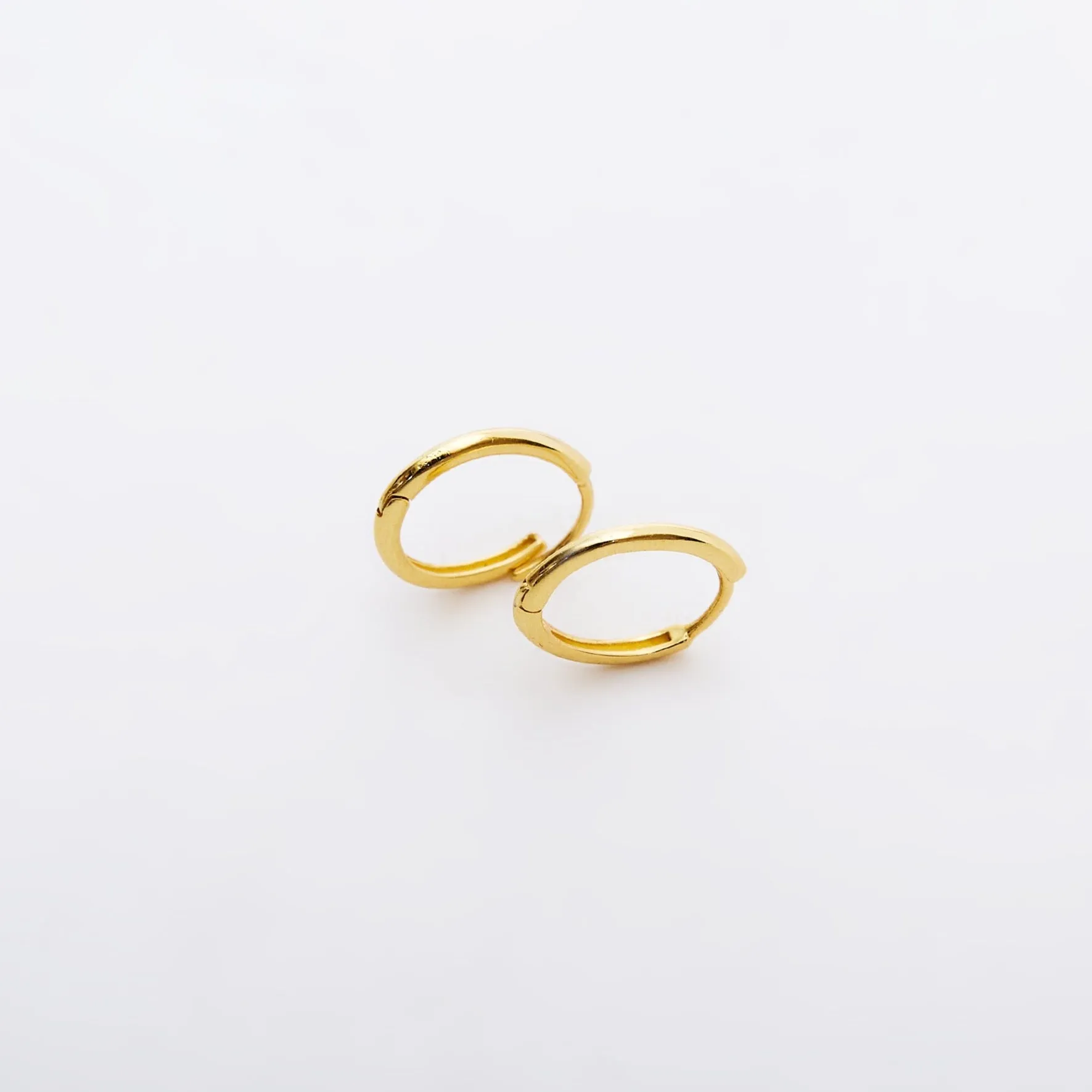 Sterling Silver Oval Hoop Earrings sold by Spero London