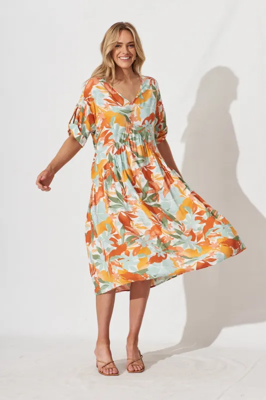 Denona Midi Dress In White With Orange Leaf Print sold by St Frock