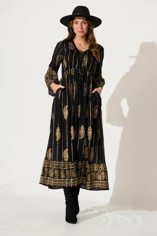 Ellie Maxi Dress In Black With Gold Print sold by St Frock