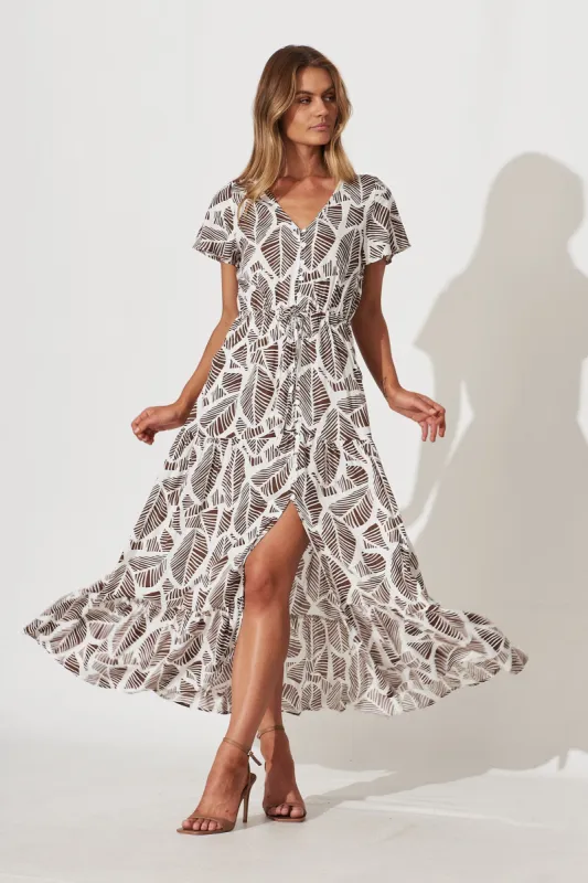 Clairie Maxi Dress In White With Brown Leaf Print sold by St Frock