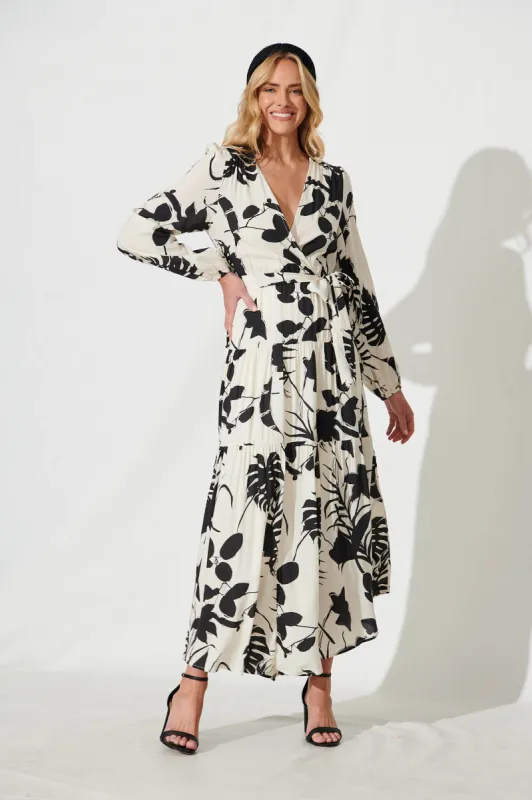 Eclair Maxi Dress In Cream With Black Leaf Print sold by St Frock