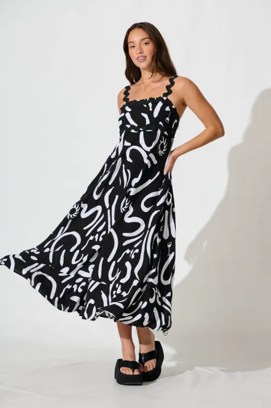 Aquila Maxi Sundress In Black Print With Black Ric Rac Trim sold by St Frock