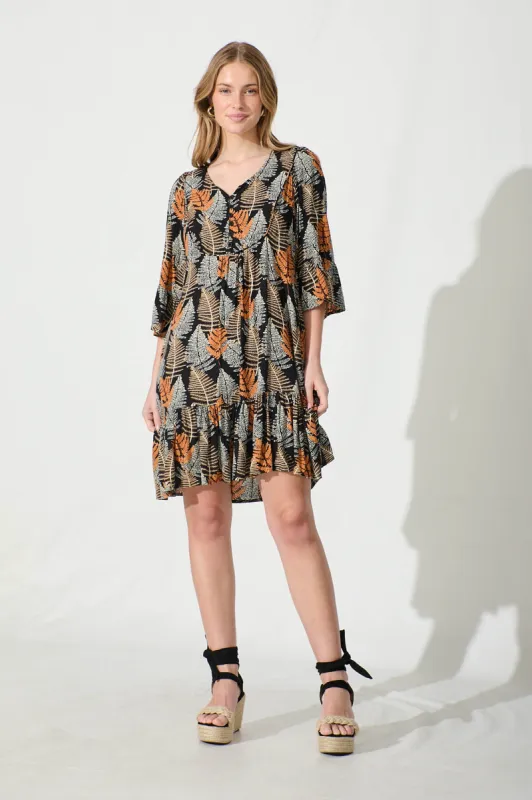 Mara Smock Dress in Black with Multi Leaf Print sold by St Frock