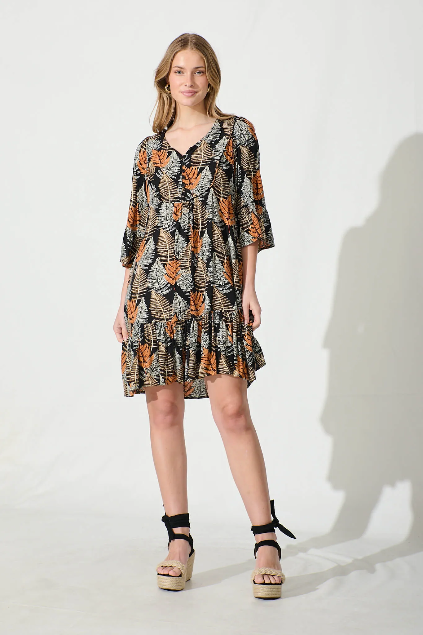 Mara Smock Dress in Black with Multi Leaf Print sold by St Frock