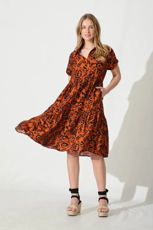 Ann Smock Dress in Rust with Black Print sold by St Frock
