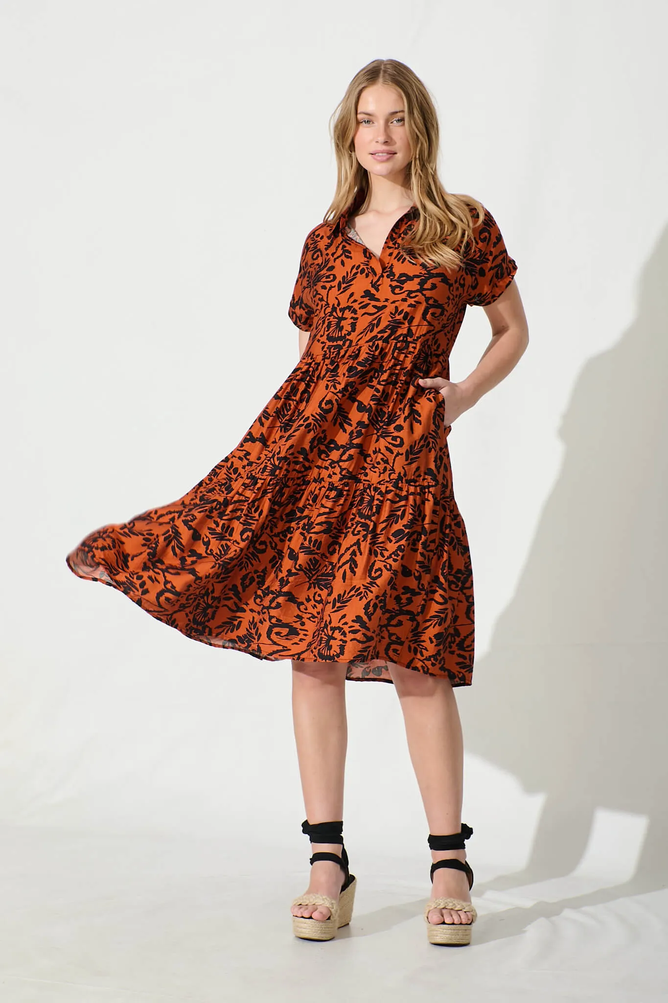 Ann Smock Dress in Rust with Black Print sold by St Frock