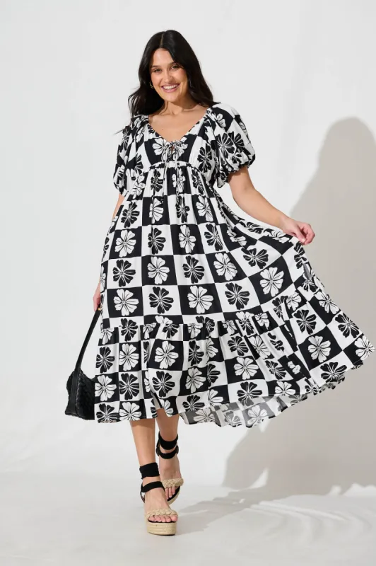 Marchena Midi Dress in Black and White Flower Print sold by St Frock