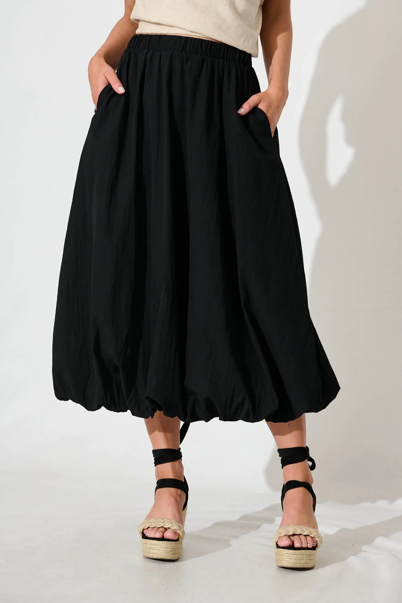 The Kiss Bubble Hem Midi Skirt in Black sold by St Frock