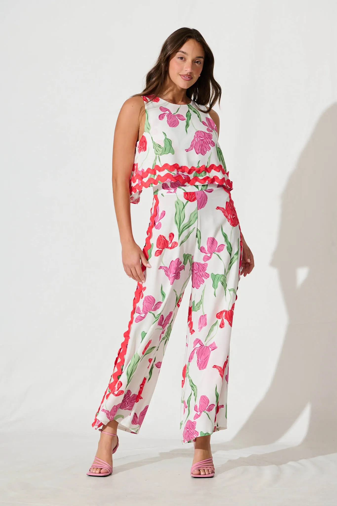 Sandbar Jumpsuit in White with Red and Purple Flower sold by St Frock
