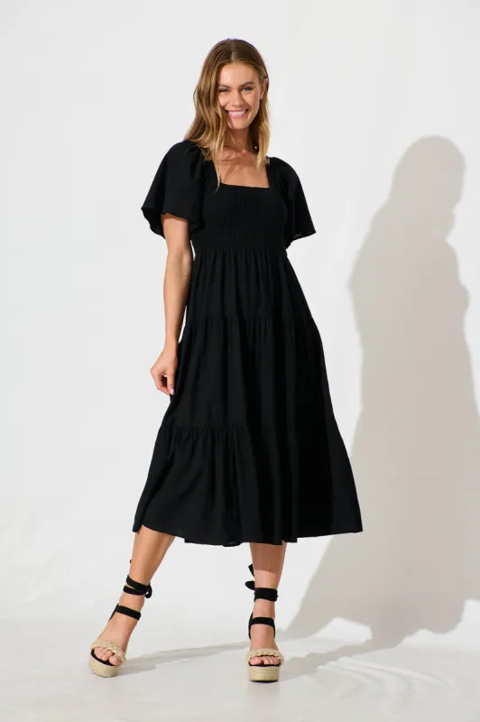 Akino Midi Dress in Black sold by St Frock