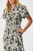 Azariah Maxi Dress in Black and Beige Swirl sold by St Frock
