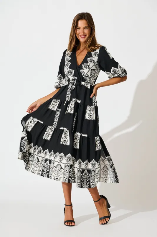 Paradise Midi Dress in Black Border Print sold by St Frock
