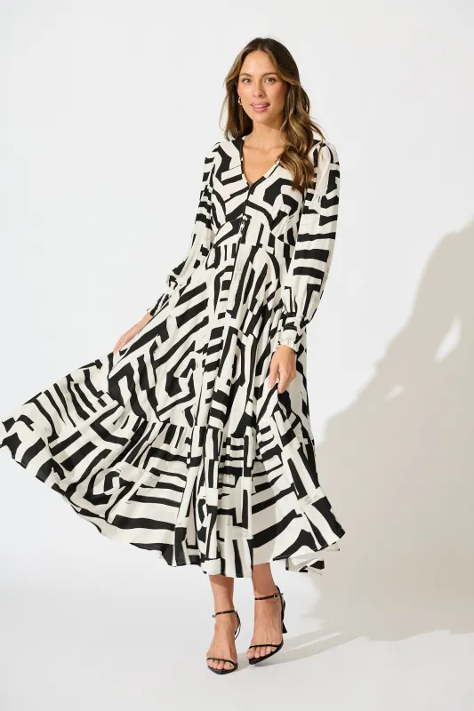 Neveena Maxi Dress in Black with White Geometric Print sold by St Frock