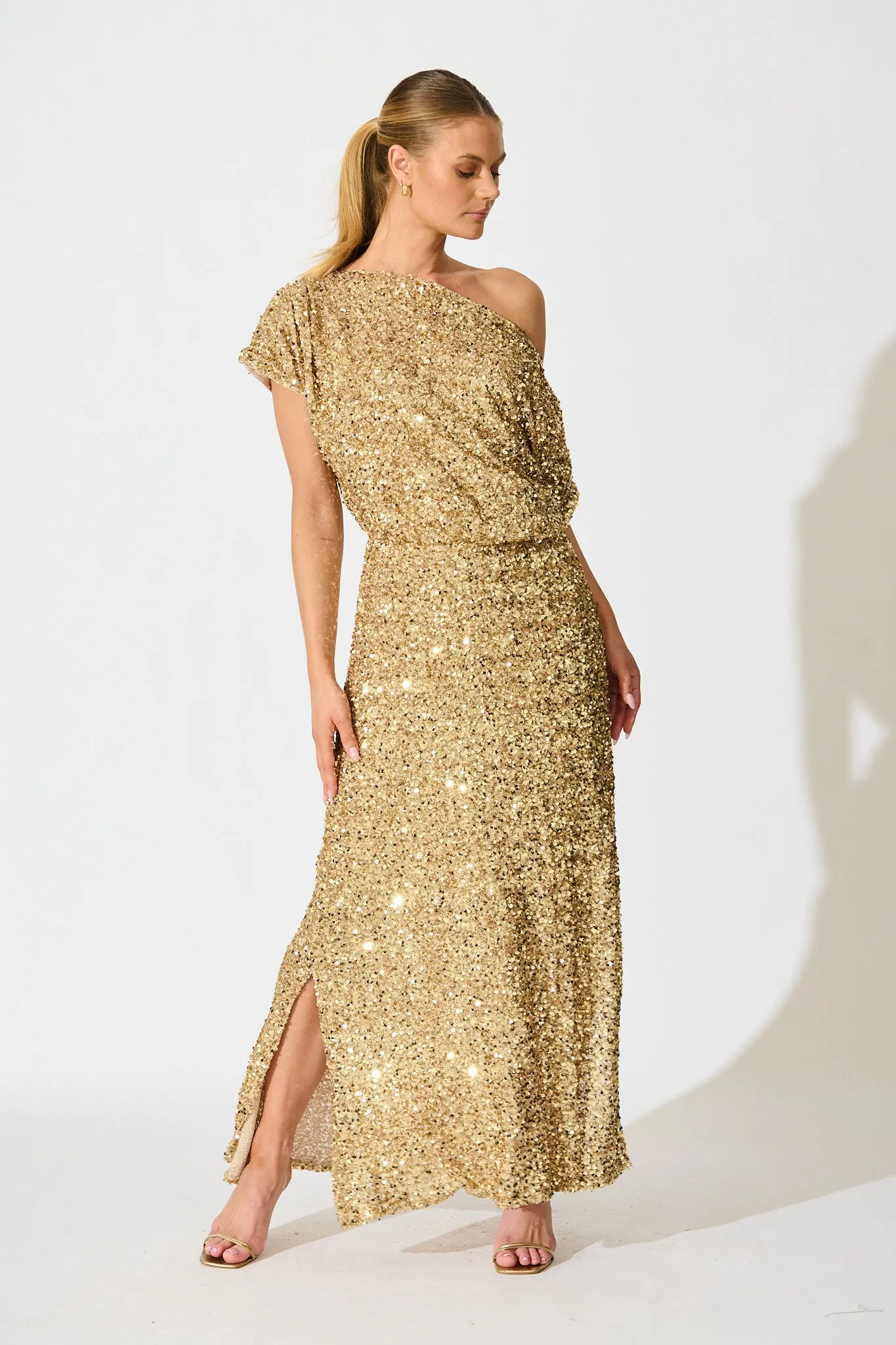 Amiri Off Shoulder Maxi Dress in Gold Sequin sold by St Frock