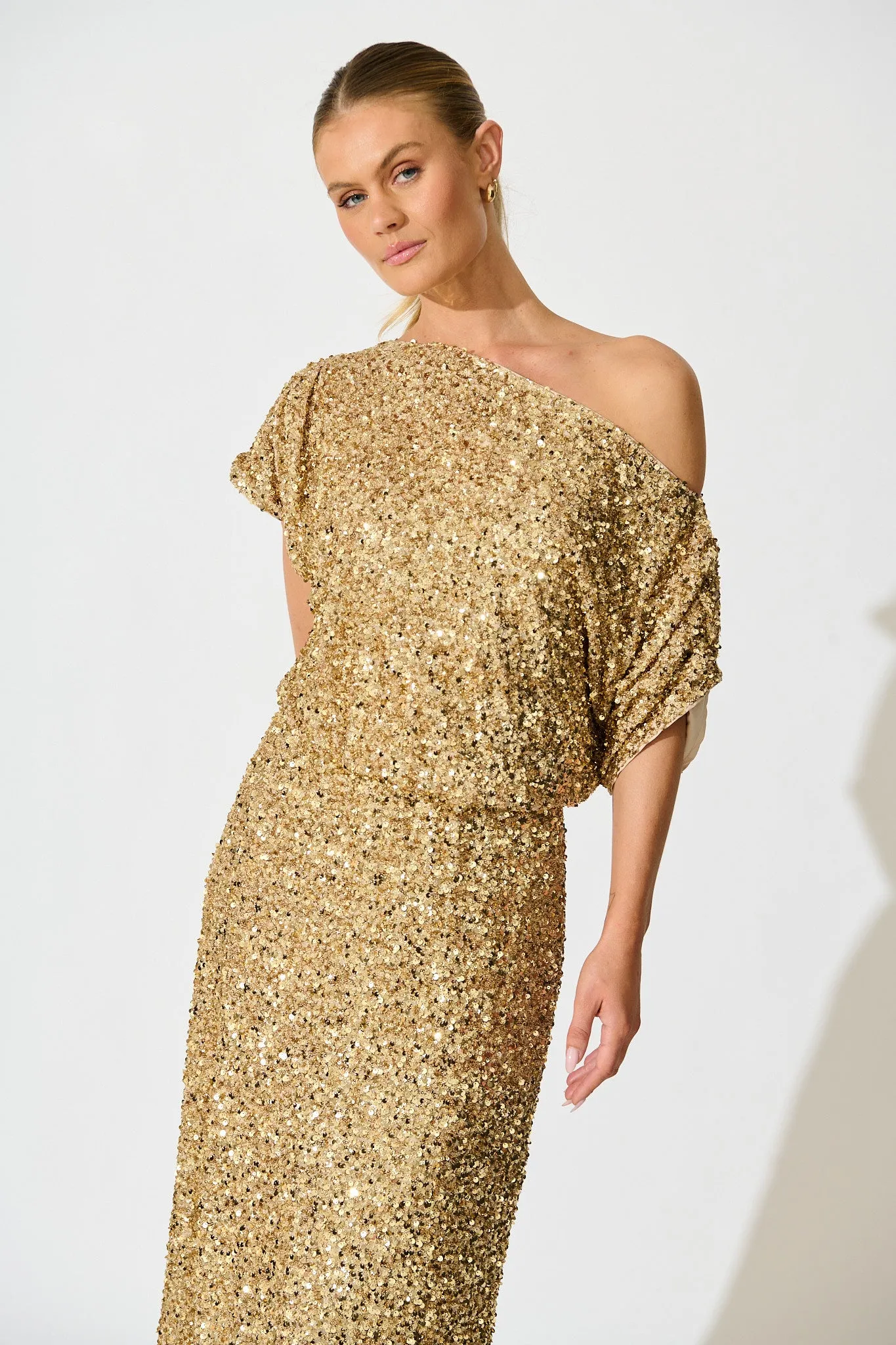 Amiri Off Shoulder Maxi Dress in Gold Sequin sold by St Frock product image thumbnail 2