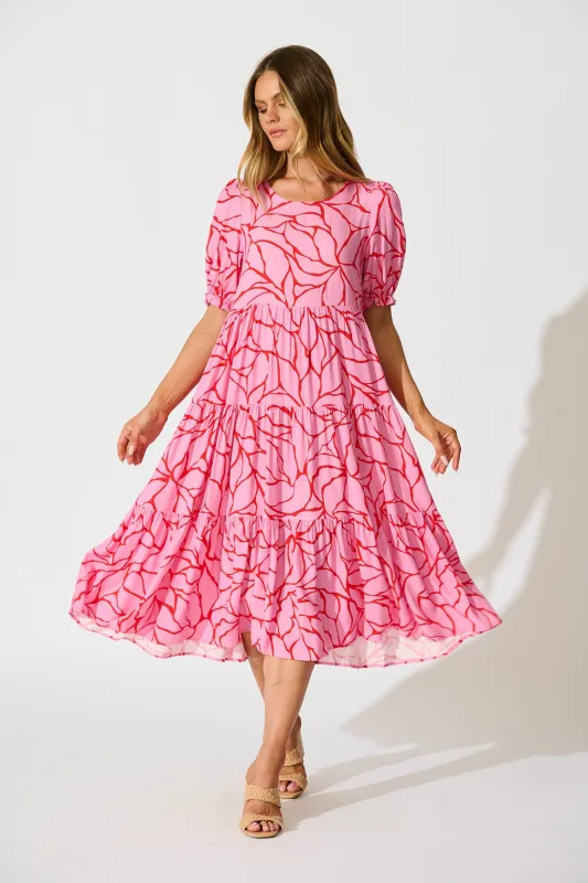 Nevi Tiered Midi Dress In Pink With Red Swirl Print sold by St Frock