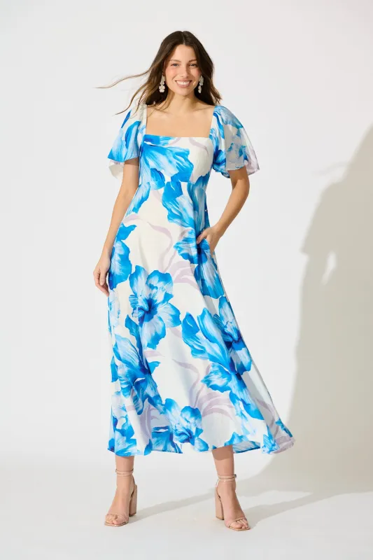 Indira Maxi Dress in White with Blue Floral sold by St Frock