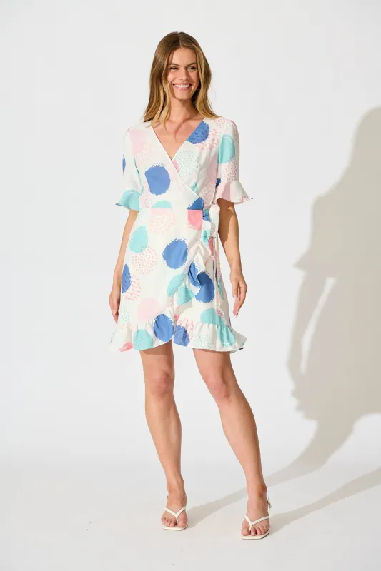 Ariane Wrap Dress In White with Multi Spot Print sold by St Frock