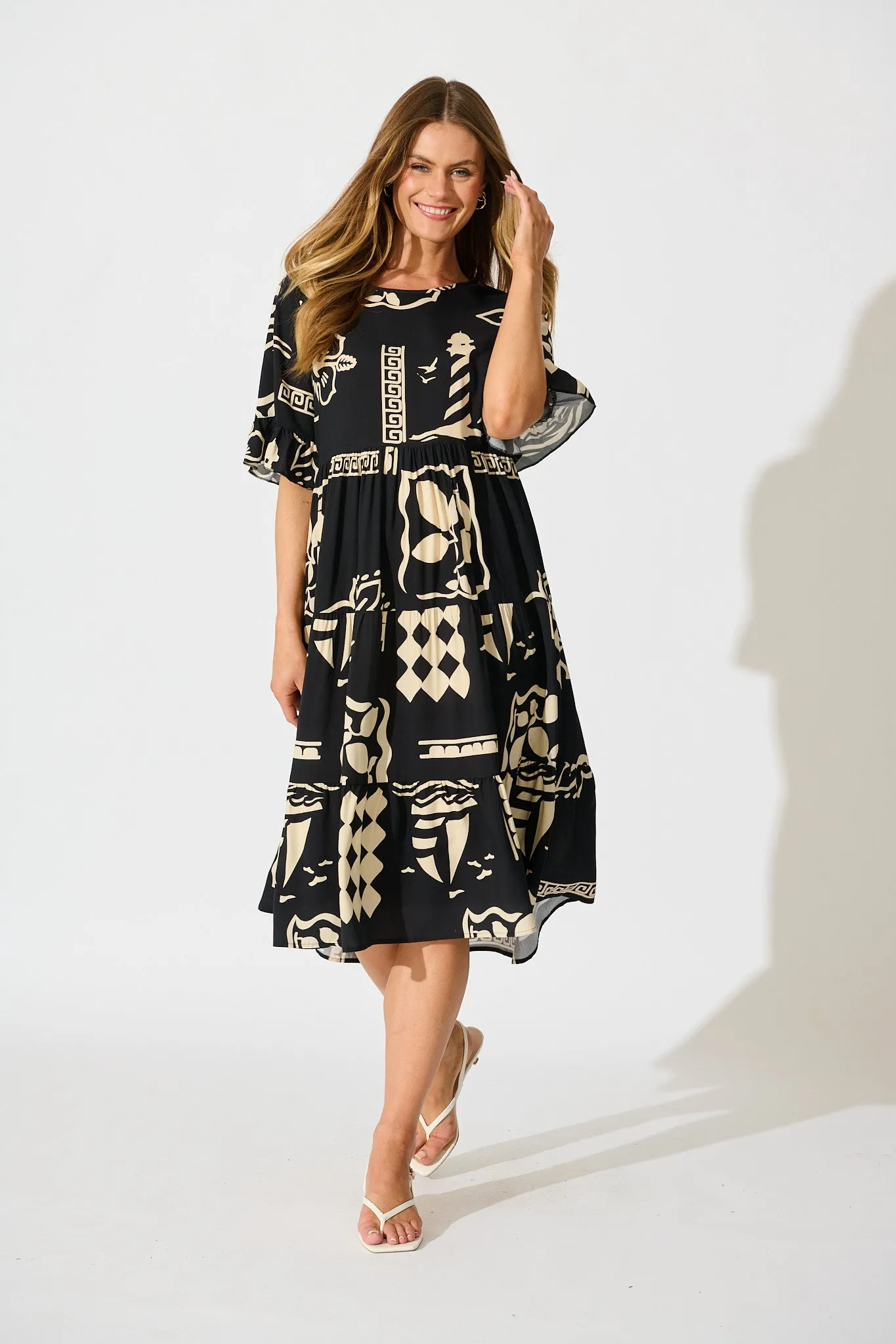 Layana Midi Dress in Black with White Print sold by St Frock