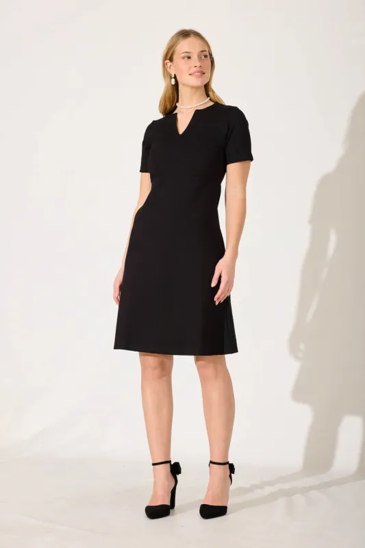 Workflow Stretch V Neck Dress In Black sold by St Frock