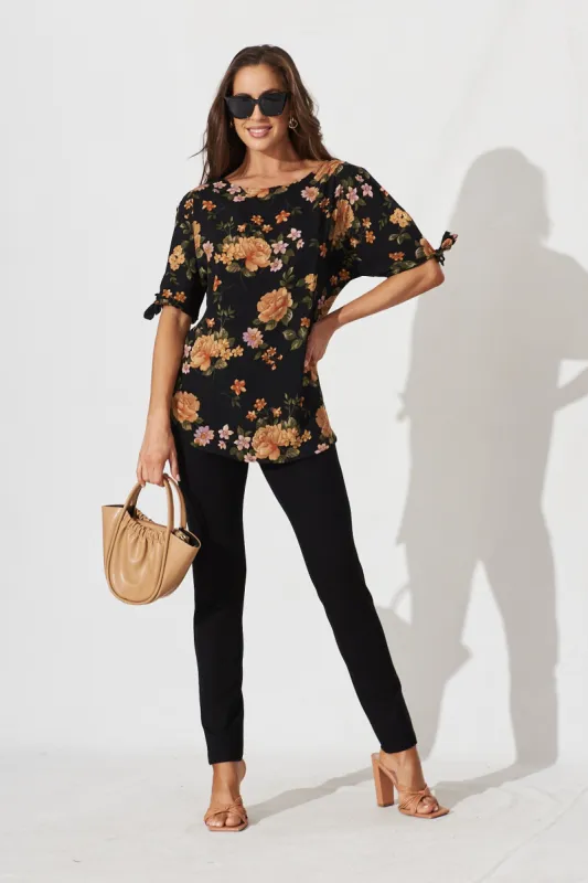 Cityscape Top In Black With Apricot Floral sold by St Frock
