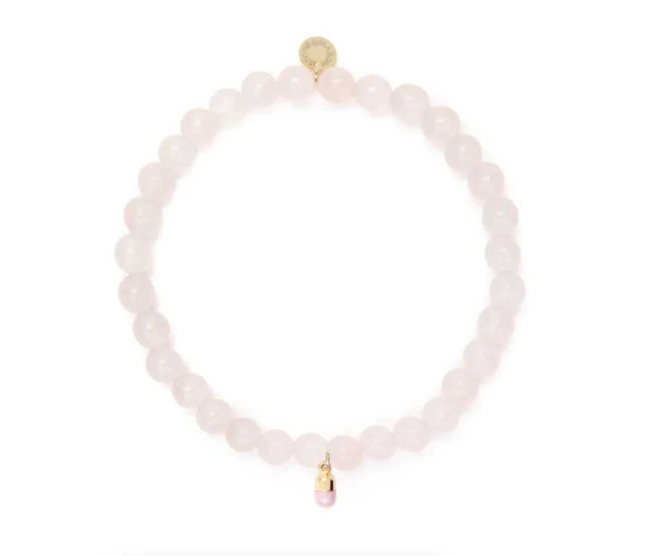 6mm Rose Quartz Bead Bracelet with Pink Pill Charm sold by Stone and Mason