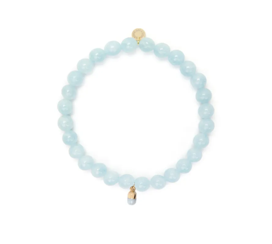 6mm Aquamarine Bead Bracelet with Blue Pill Charm sold by Stone and Mason